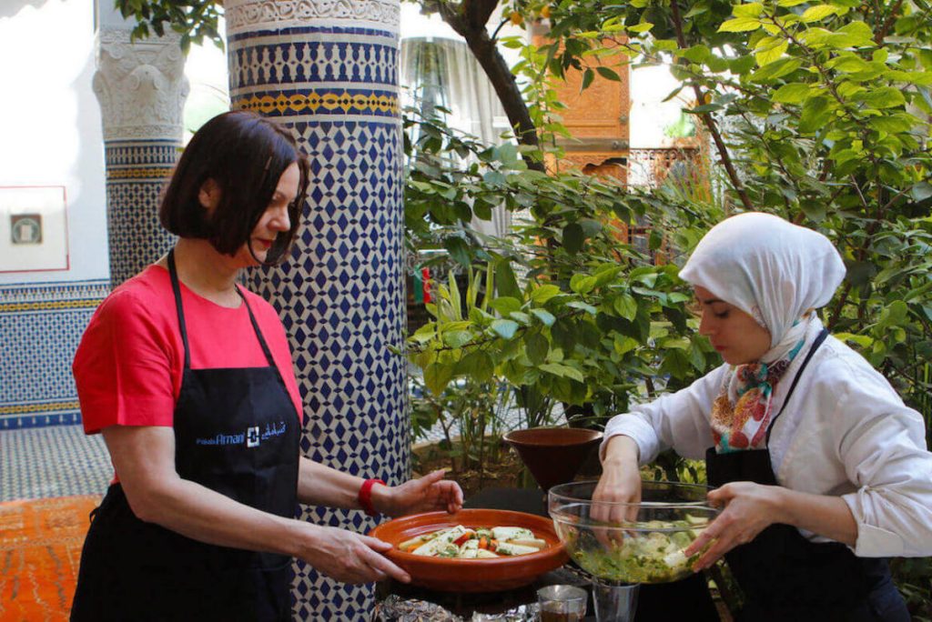 A private Moroccan cooking class laid out in a garden