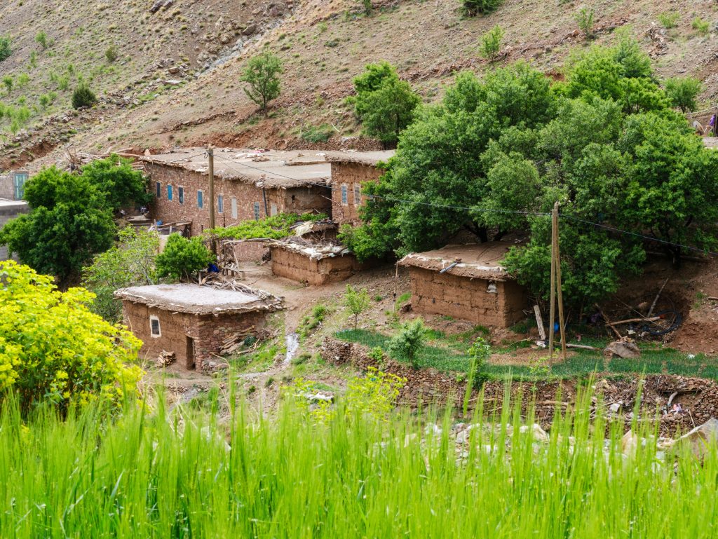 Earth built Berber village and barley terraces in a High Atlas valley