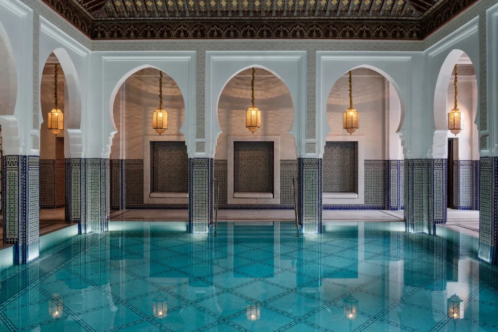 Carved arch and warm light in a Moroccan bath house