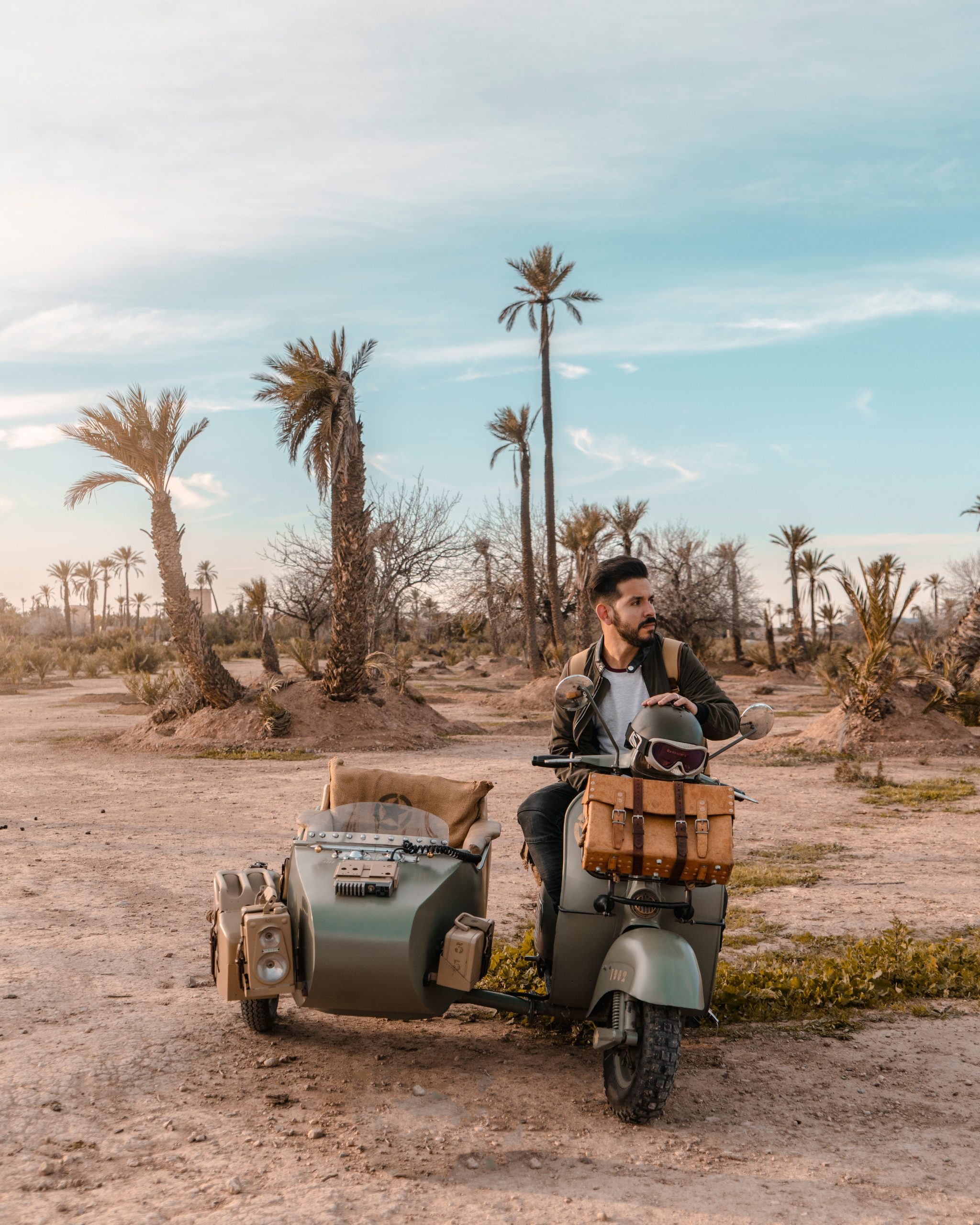 Vintage motorcycle sidecar parked among the palm trees of the Marrakech palmeraie